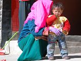 12 Tibetan Mother And Son Outside Chuku Nyenri Gompa On Mount Kailash Outer Kora A Tibetan mother and her son pose for me in front of the Chuku (Nyenri) Gompa